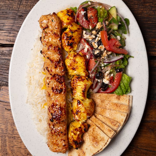 Oliver Pepper's Mediterranean platter with grilled chicken, rice, salad, and pita bread.