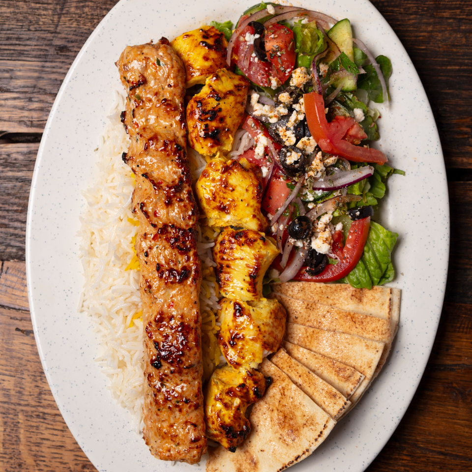 Oliver Pepper's Mediterranean platter with grilled chicken, rice, salad, and pita bread.